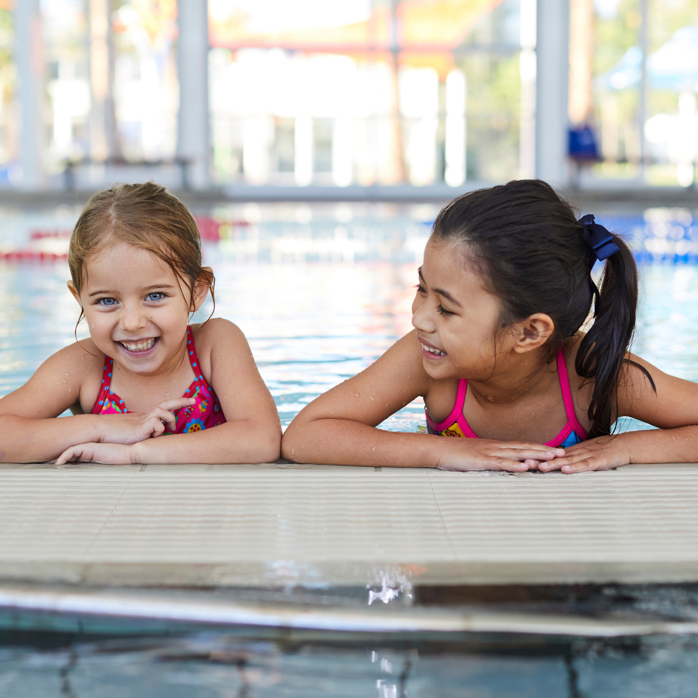 Two young girls in swimming pool