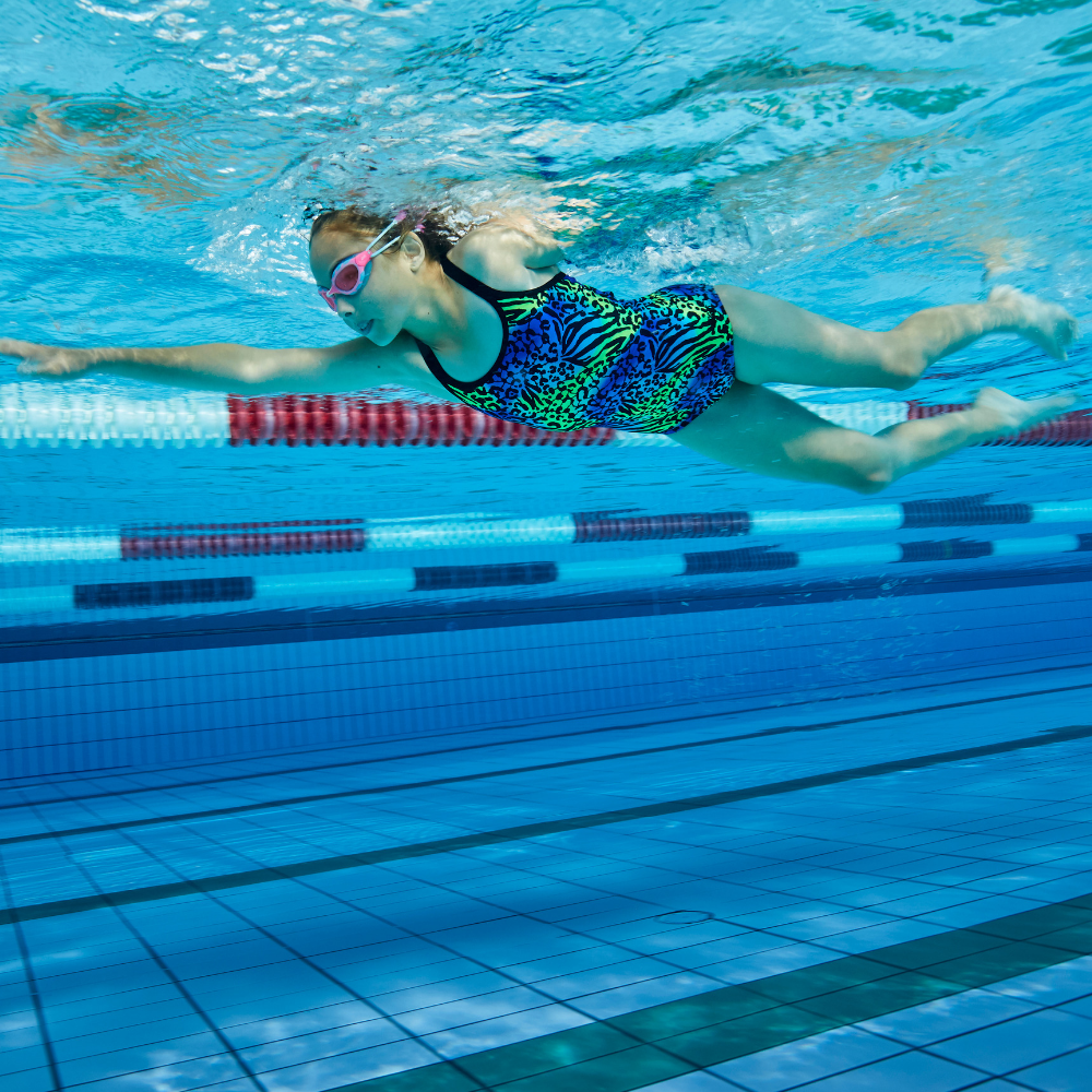 Underwater view of young girl lap swimming
