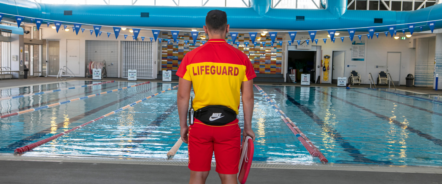 Lifeguard watching over swimming pool