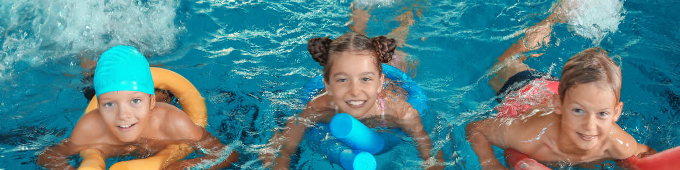 Young girl swimming laps in pool