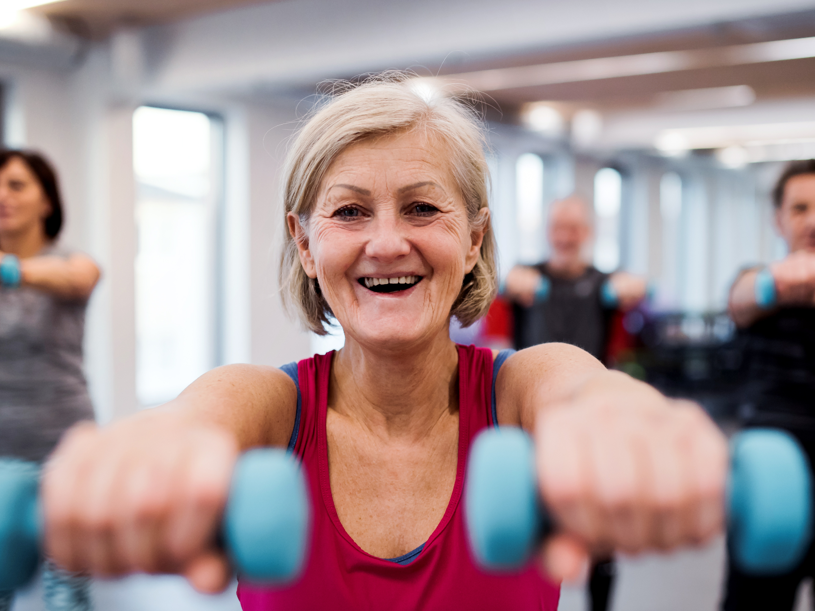 Senior woman exercising in gym